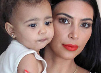 Kim Kardashian holding her baby North