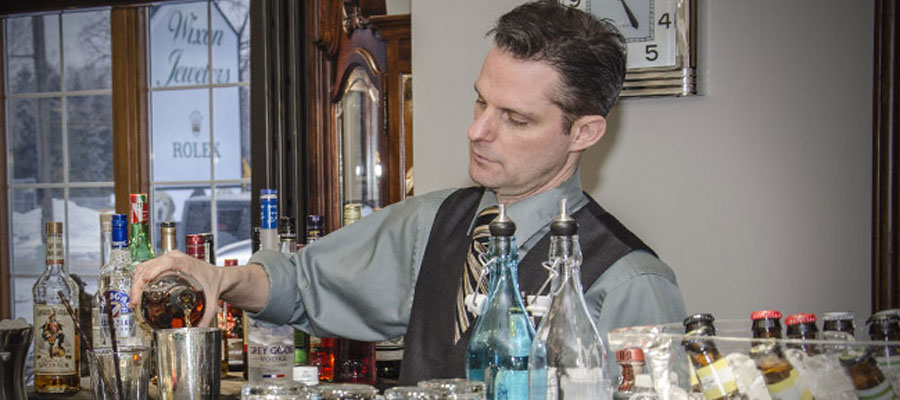 Blog_2015—Bartender Christopher Green mixing a cocktail
