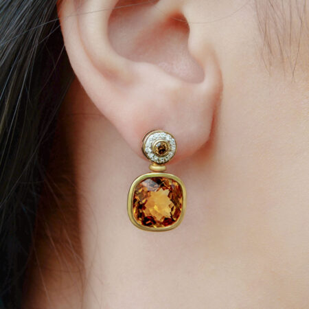 Citrine earrings on ears