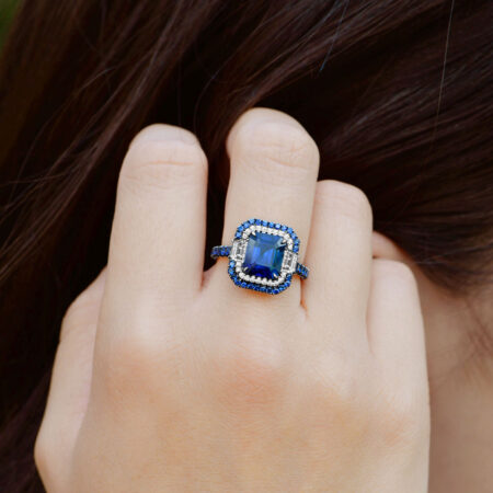 Double Halo Burmese Sapphire ring on hand