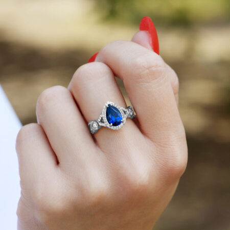 Sapphire pear shaped ring on hand