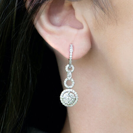 Diamond Dangle Earrings on ear