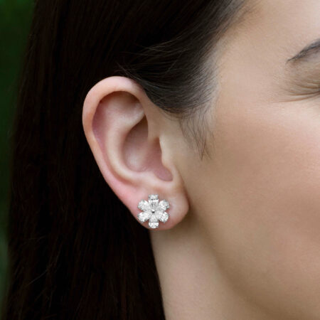 Diamond Flower Stud Earrings with Pear Shaped Diamonds Pear-Shaped Diamond Flower Earrings on ear