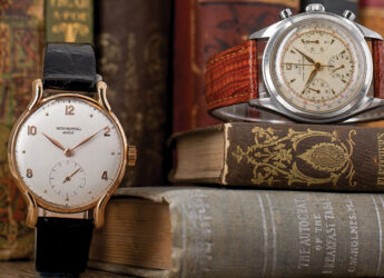 Two vintage/pre-owned watches on vintage books