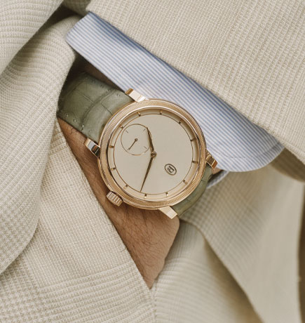 Parmigiani Fleurier on Toric Petite Seconde on man's wrist