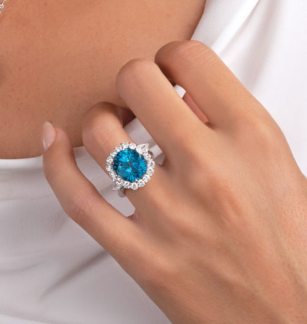 Blue zircon ring on woman's hand